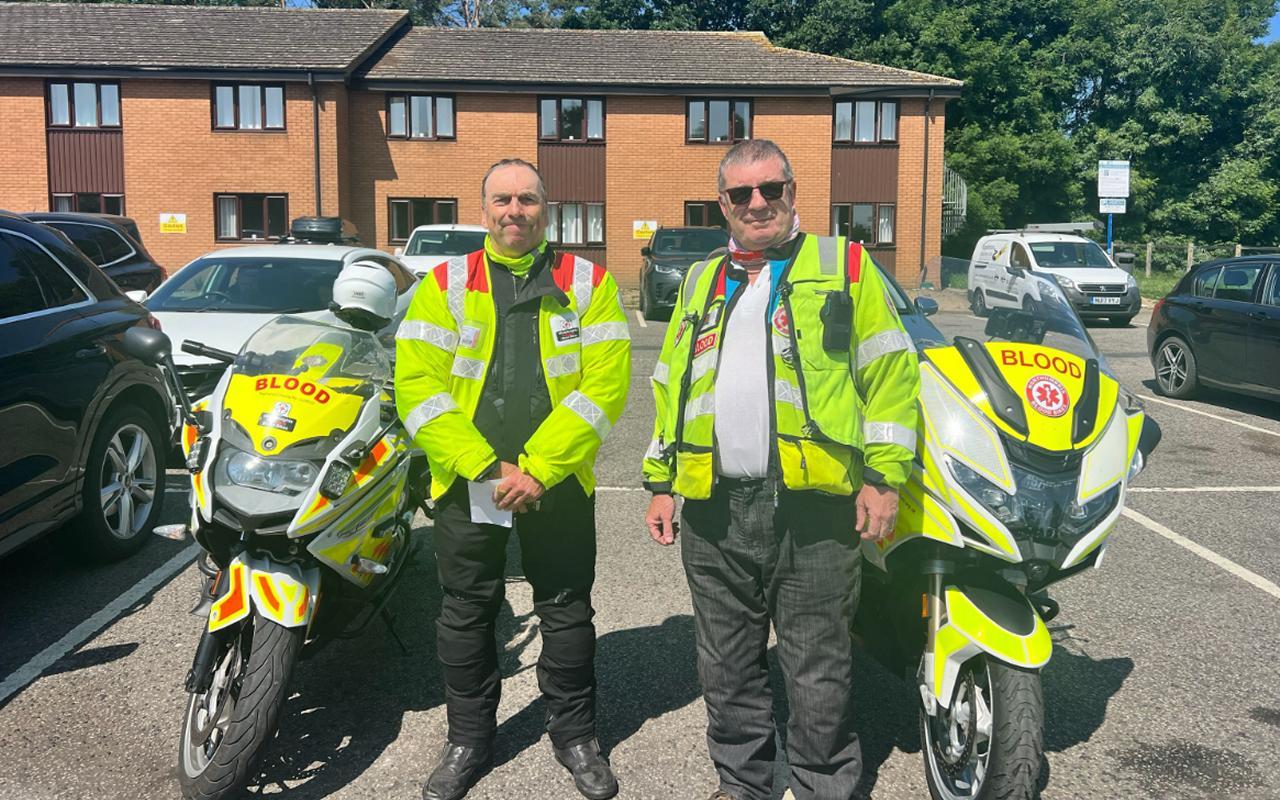 Photo of blood bikers from two groups handing over a relay package
