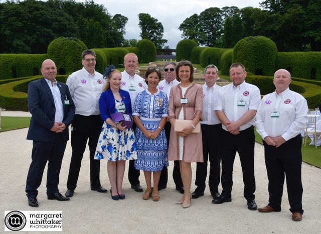 A photo of NBB receiving the Queen's Award