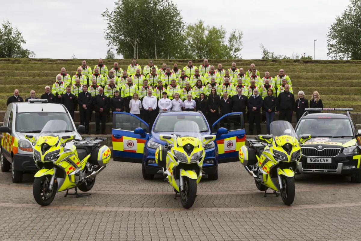 cropped vehicles and team